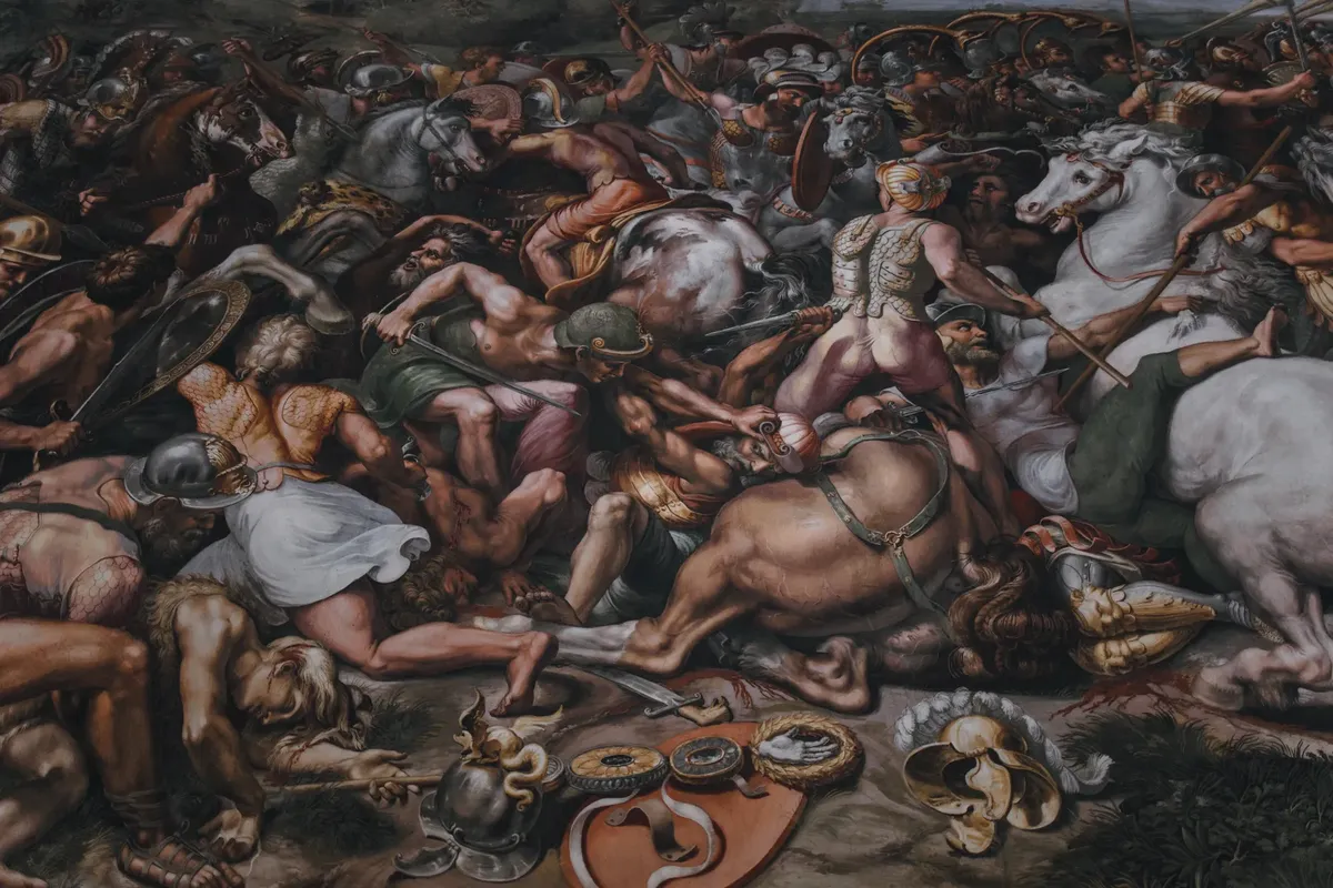 Intricate Renaissance mural depicting a dramatic battle scene, located in Vatican City.