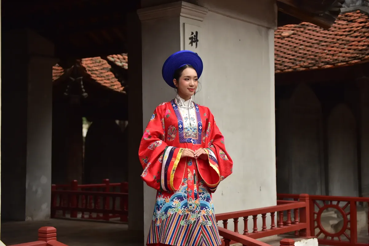 A woman in traditional Vietnamese clothing in a historical architectural setting, showcasing cultural heritage.